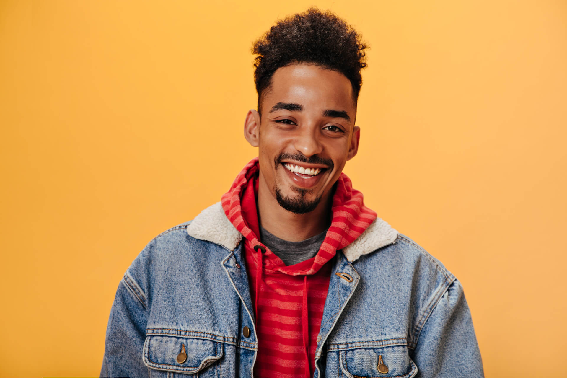 african-american-man-in-denim-jacket-smiling-on-or-2021-09-02-23-59-28-utc.jpg